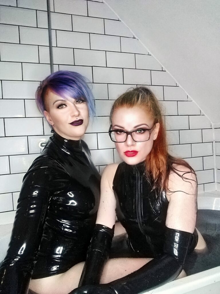 Lady valeska in latex with Fraeulein K in latex in a bathtub posing two London Mistresses